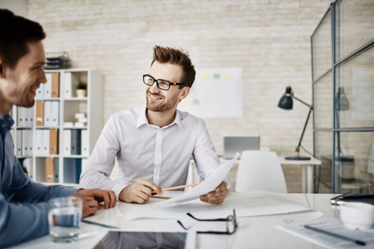 Business professionals discussing a project